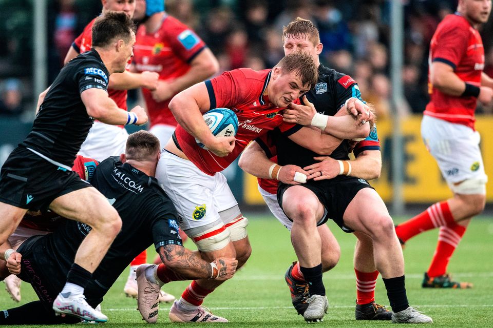 Munster's Gavin Coombes is tackled by Johnny Matthews of Glasgow Warriors during their URC quarter-final at Scotstoun Stadium, Glasgow. Photo: Paul Devlin/Sportsfile