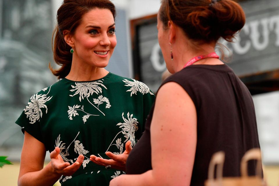 Catherine, Duchess of Cambridge (L), talks to an exhibitor as she visits the RHS Chelsea Flower Show press day at Royal Hospital Chelsea on May 22, 2017 in London, England