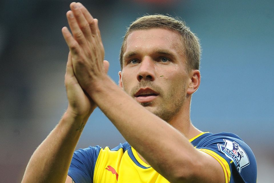 Arsenal's Lukas Podolski says 'hell will freeze over' before he joins bitter rivals Tottenham