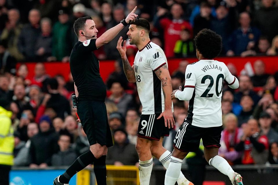 Fulham's Aleksandar Mitrovic (centre) being sent off by referee Chris Kavanagh during the FA Cup quarter-final match at Old Trafford, Manchester