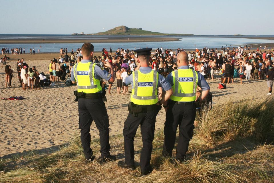 Gardaí at Burrow Beach in Sutton, Dublin, this afternoon. Photo: Padraig O'Reilly