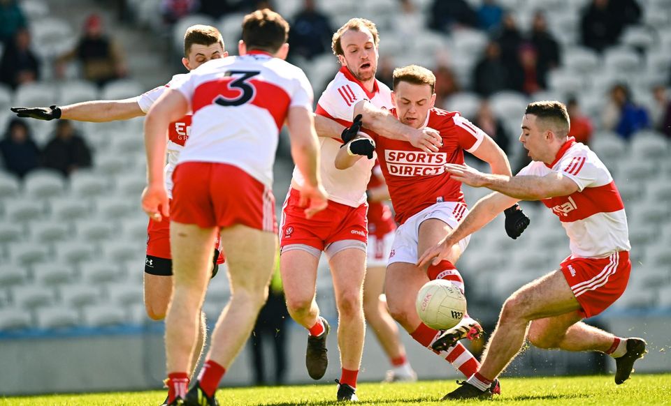 Cork's Steven Sherlock surrounded by Derry players during the Football League Division 2 match at Páirc Ui Chaoimh in March
