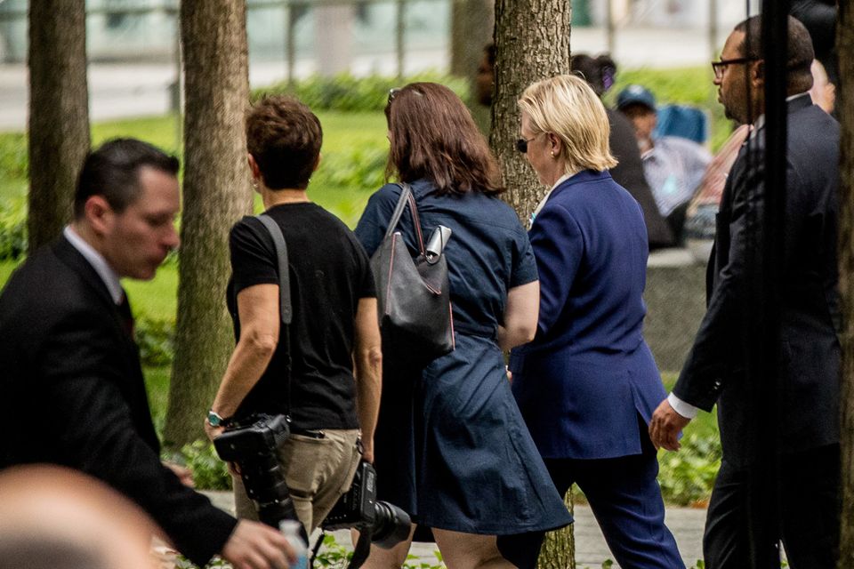 Hillary Clinton (second from right) leaving the ceremony in New York