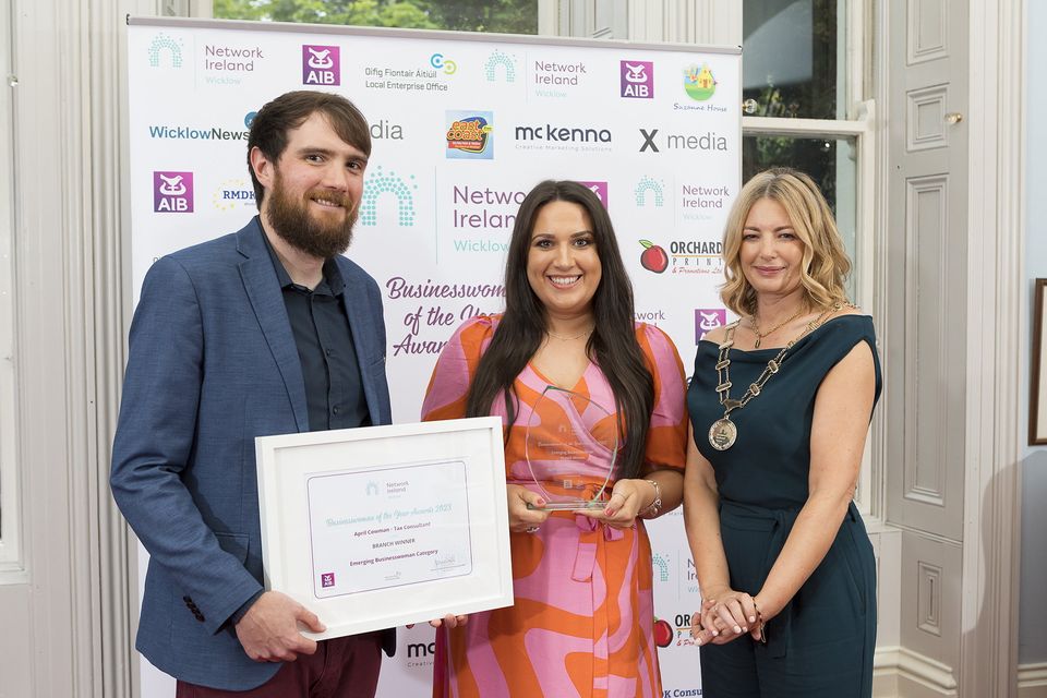 Shane Doyle, April Cowman, Emerging Businesswoman of the Year, and Joanne Costello.