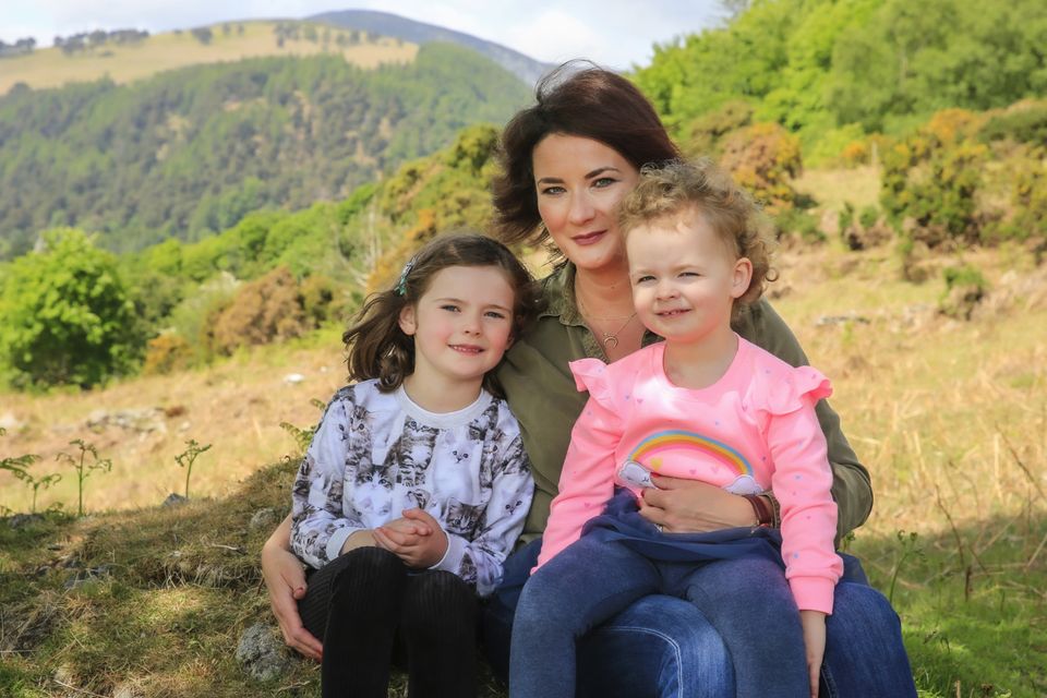 Lynne Byrne with daughters Ellen and Emily at their home overlooking Glendalough. Photo: Gerry Mooney
