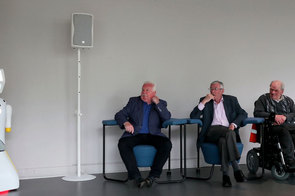 IrelandÕs first socially assistive AI robot 'Stevie II' from robotics engineers at Trinity College Dublin waits to be unveiled during a special demonstration at the Science Gallery in Dublin, as Mick McCarthy (left) Tony McCarthy (centre) and Brendan Crean, who all helped trial the robot through the charity ALONE look on
Brian Lawless/PA Wire