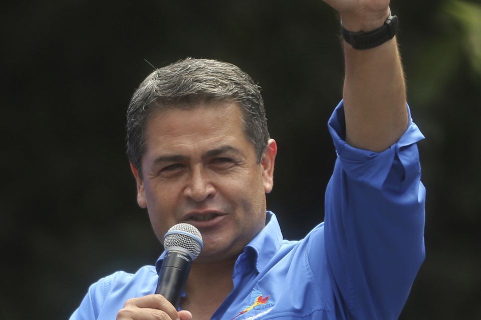 Honduran president Juan Orlando Hernandez has been declared the winner of the disputed election (AP)