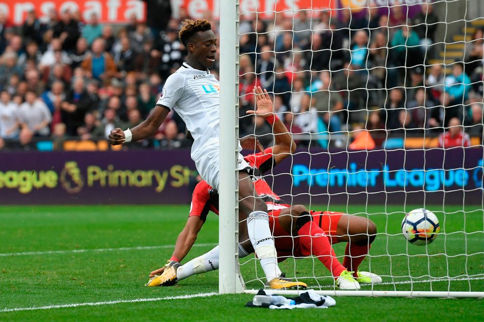 Swansea striker Tammy Abraham scores his second goal despite the challenge of Zanka. Photo: Getty Images