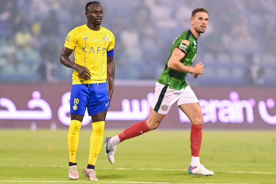 Al-Ettifaq's Jordan Henderson in action against Al Nassr's Sadio Mane