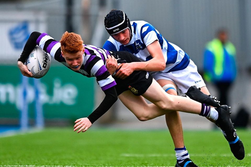 20 March 2023; Conor Quinn of Terenure College is tackled by Geoffrey Wall of Blackrock College during the Bank of Ireland Leinster Rugby Schools Junior Cup semi-final replay match between Terenure College and Blackrock College at Energia Park in Dublin. Photo by Ben McShane/Sportsfile