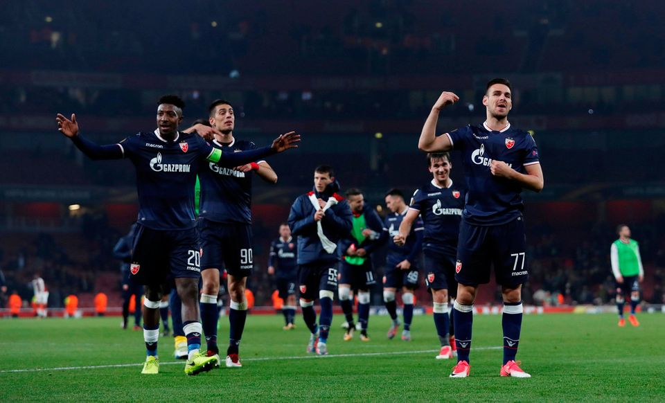 Red Star Belgrade's Mitchell Donald, Marko Gobeljic and team mates celebrate after the match. Photo: Reuters/Andrew Couldridge