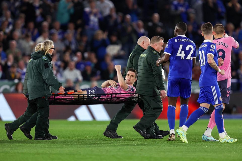 Everton captain Séamus Coleman gestures to fans as he leaves the field on a stretcher during the Premier League match against Leicester City at The King Power Stadium. Photo by James Williamson - AMA/Getty Images