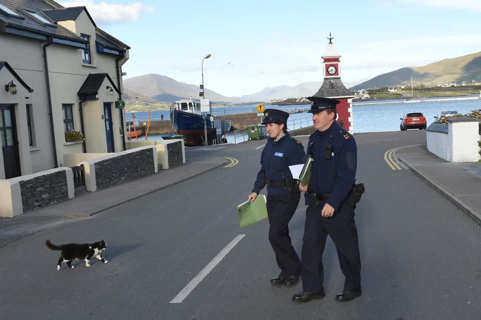 Gardaí conduct door-to-door enquiries at Knightstown on Valentia Island in Co Kerry as the investigation into the murder of Baby John was reopened in 2018. Photo: Don MacMonagle