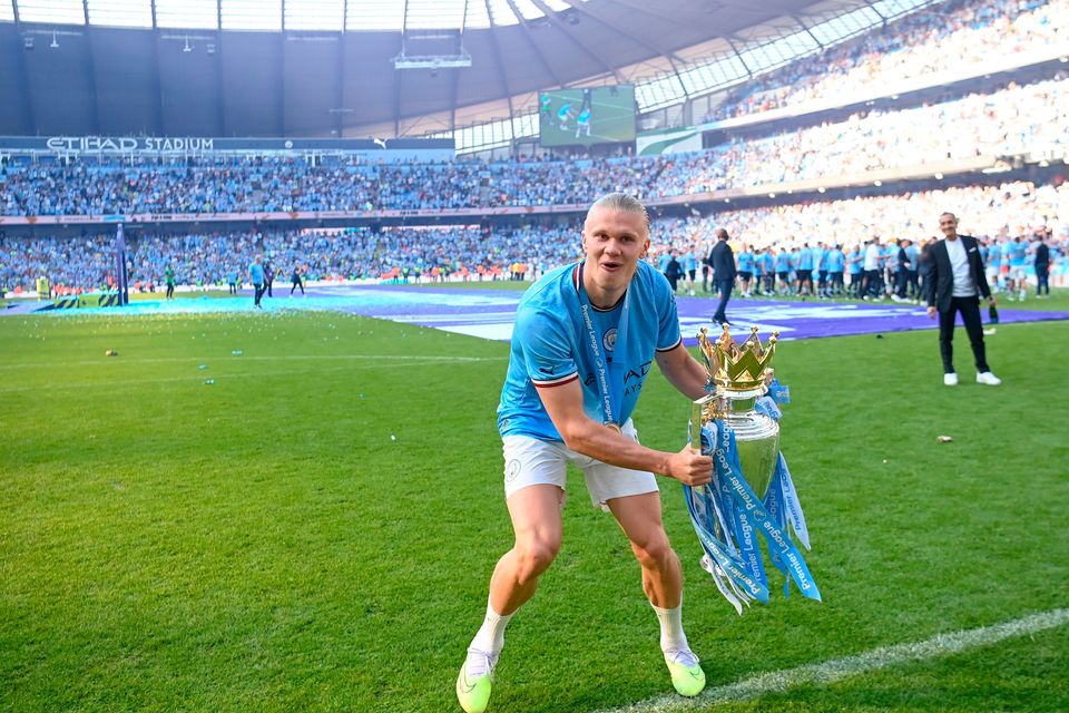 Erling Haaland of Manchester City celebrates with the Premier League trophy