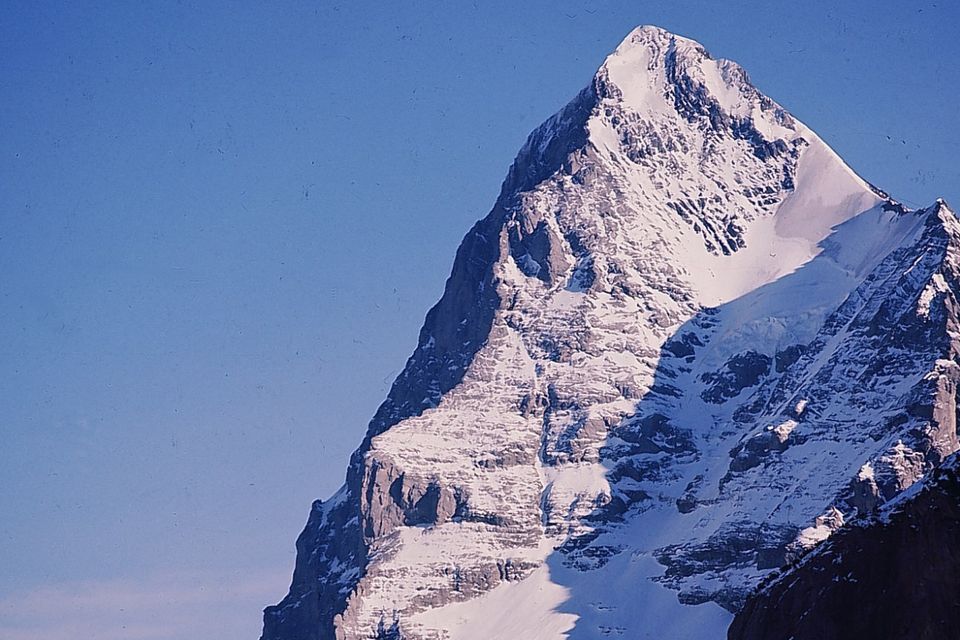 The magnificent Eiger, with its jagged teeth-like ridges, towers over all it surveys.