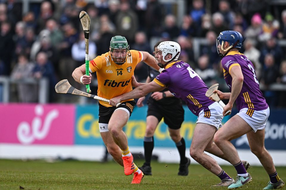 Niall McKenna of Antrim in action against Niall Murphy, left, and Shane Reck of Wexford. Photo: Sam Barnes/Sportsfile