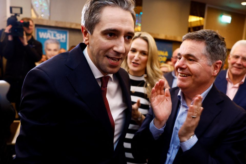 Simon Harris is applauded by Public Expenditure and Reform Minister Paschal Donohoe and Justice Minister Helen McEntee at the Fine Gael convention in Athlone. Photo: Reuters/Clodagh Kilcoyne