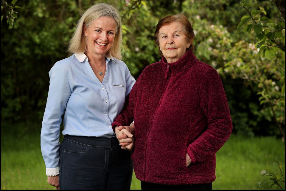 Niamh Gilchrist with her mother Lily Gilchrist, who is living with primary progressive aphasia (PPA) at their home in Longford. Photo: Steve Humphreys