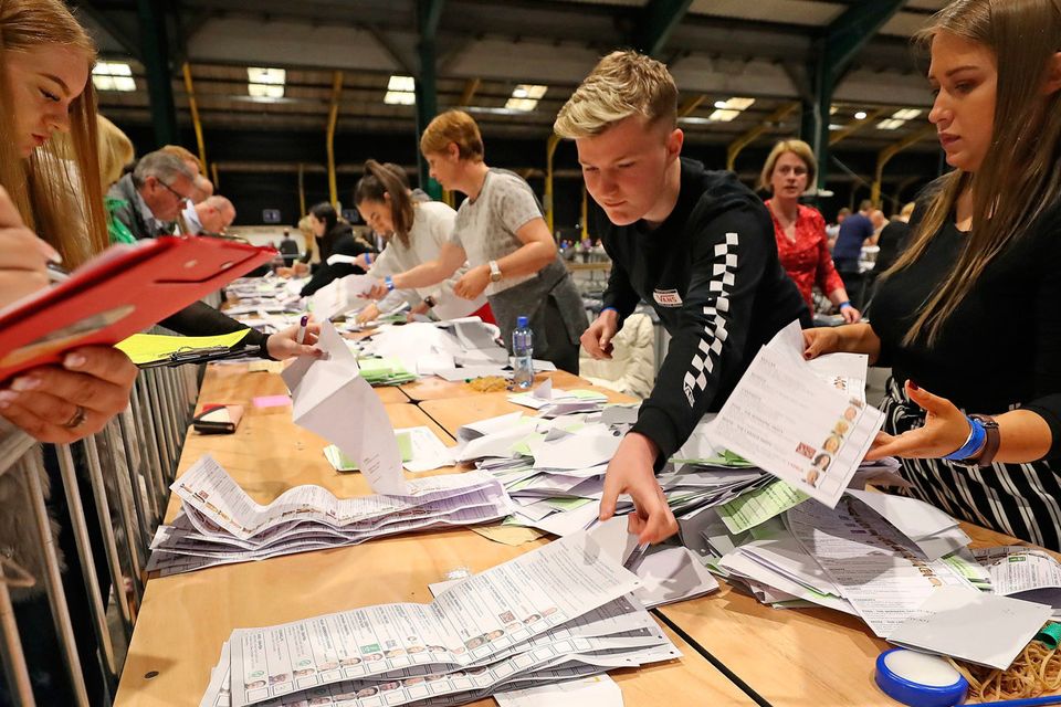The ballot boxes are opened at the RDS in Dublin on Saturday morning. Photo: Niall Carson/PA Wire