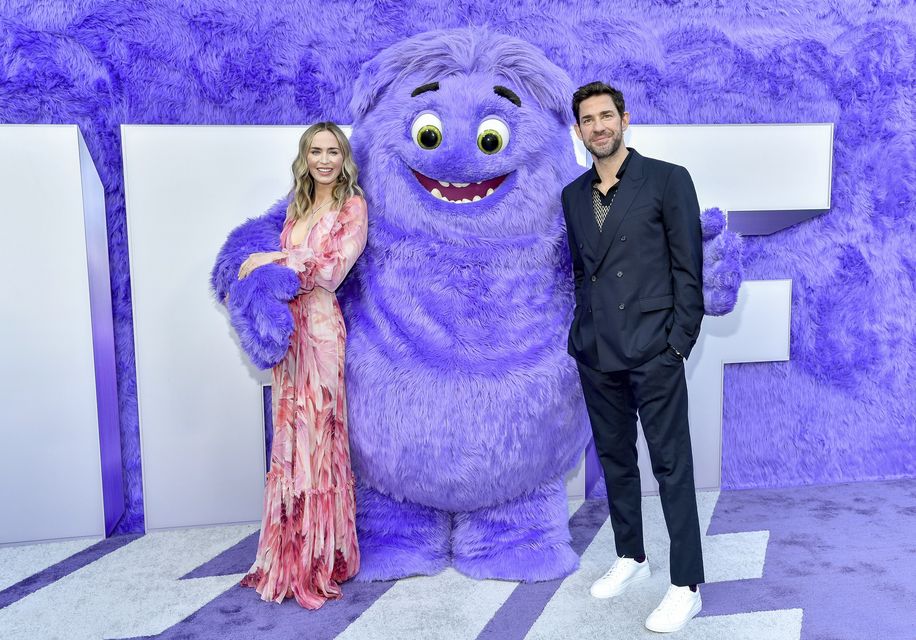 Emily Blunt and John Krasinski pose with the character Blue at the premiere of Paramount Pictures’ IF at the SVA Theatre in New York (Evan Agostini/Invision/AP)
