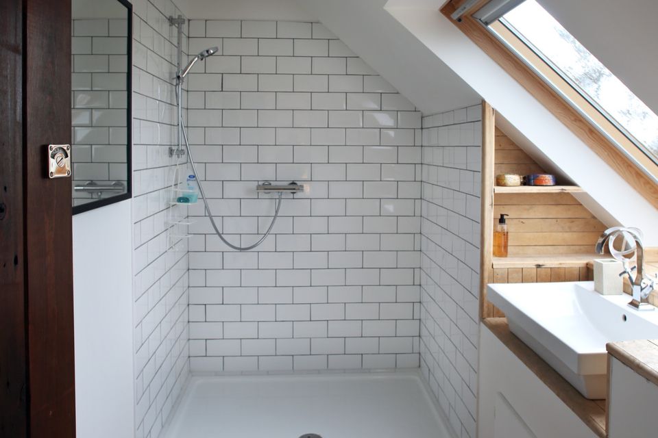 Louise opted for a simple style in each bathroom using white sanitary ware and metro tiles.