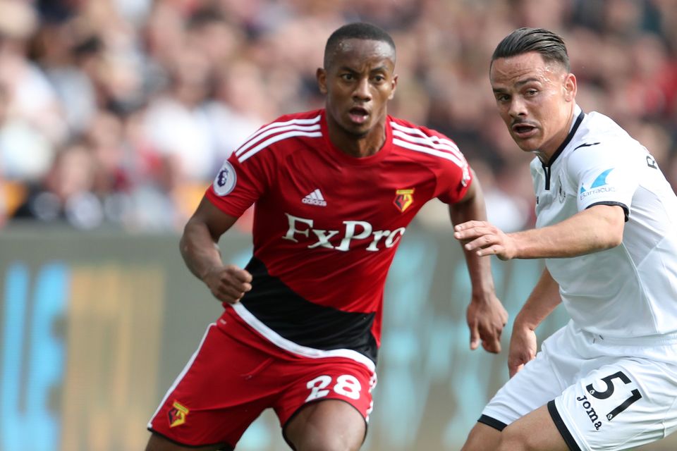 Watford's Andre Carrillo (left) and Swansea City's Roque Mesa battle during the Hornets' 2-1 Premier League win at the Liberty Stadium.