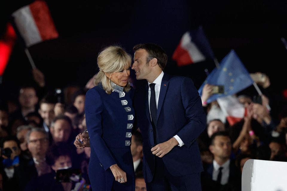 Second term: President Emmanuel Macron kisses wife Brigitte Macron after being re-elected during his victory rally at the Champs de Mars in Paris. Photo: Benoit Tessier/Reuters