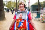 thumbnail: Mandy Ellis shows off her dress made of four tea towels near Buckingham Palace, London, ahead of the the coronation of Britain's King Charles. Photo: Nathan Denette /The Canadian Press via AP
