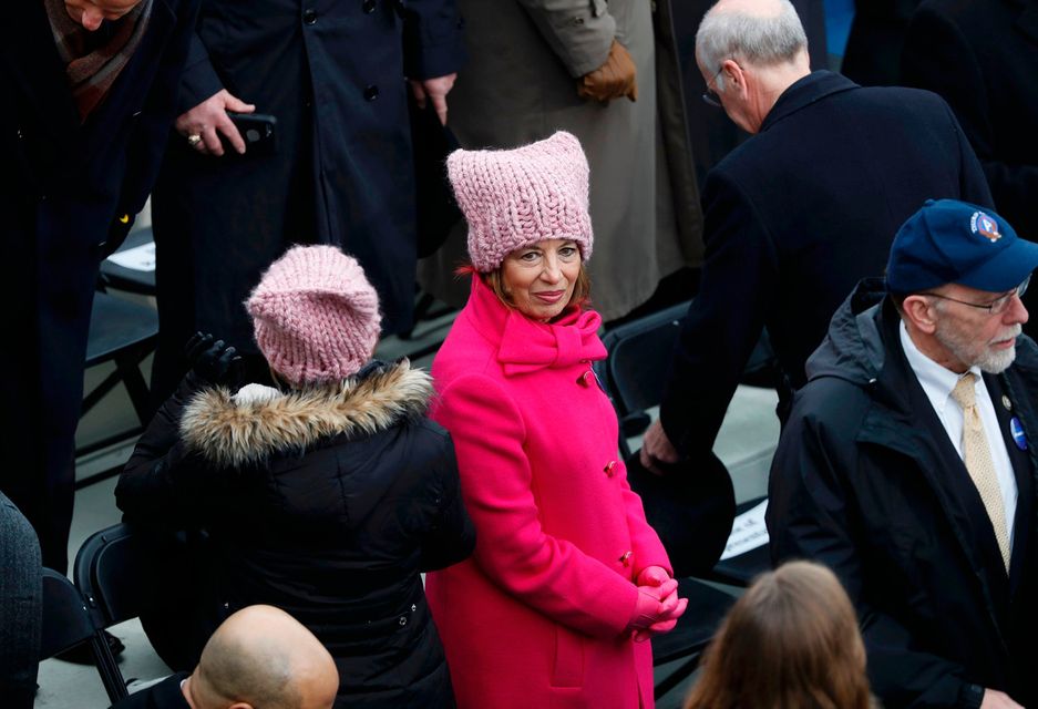 U.S. Rep. Jackie" Speier (C) and another woman wear their pink protest hats, symbols of the anti-Trump women's march, as people gather prior to U.S. President-elect Donald Trump's inauguration as the nation's 45th president in Washington, U.S., January 20, 2017.    REUTERS/Brian Snyder