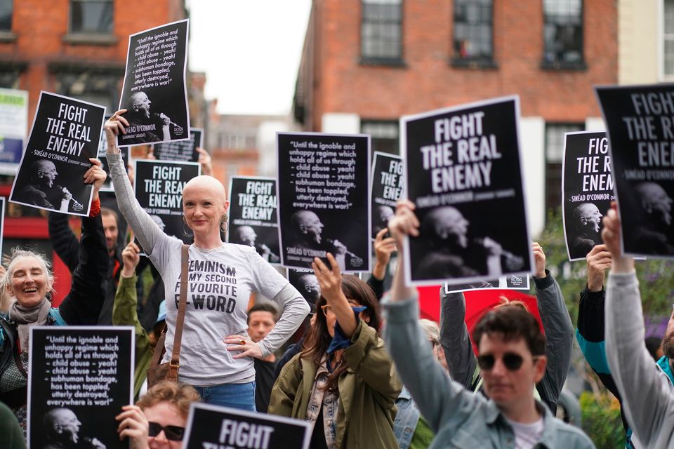 Karen Dempsey joins fans at Barnardo Square in Dublin's city centre to sing in memory of Sinéad O'Connor, at an event organised by feminist group ROSA. Photo: PA