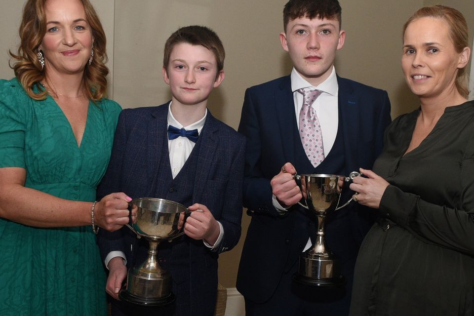 Banteer/Lyre Juvenile GAA Chairperson Esther O'Keeffe and Secretary Eimear Crowley pictured with U13 Hurling captain Patrick O'Connor and U15 Football captain Cian O'Keeffe at the club Victory Function. Picture John Tarrant