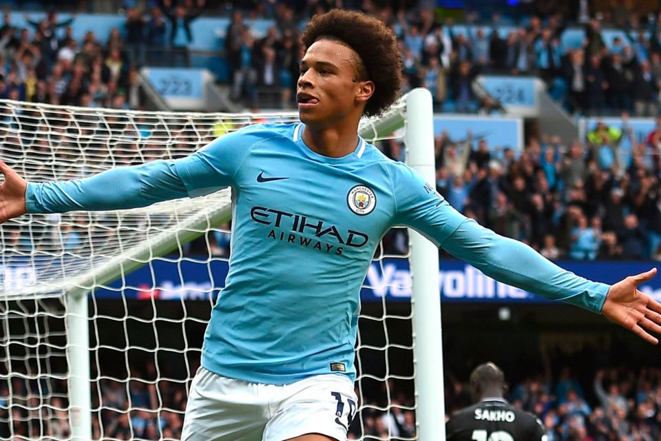 Leroy Sane celebrates after scoring Manchester City’s first goal yesterday in the 5-0 win overCrystal Palace,and, right, Jose Mourinho is sent from the line by referee Craig Pawson. Photo: AFP/Getty