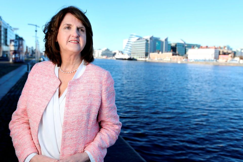 Labour leader and Tánaiste Joan Burton beside her party headquarters in the Dublin Docklands yesterday Photo: Gerry Mooney