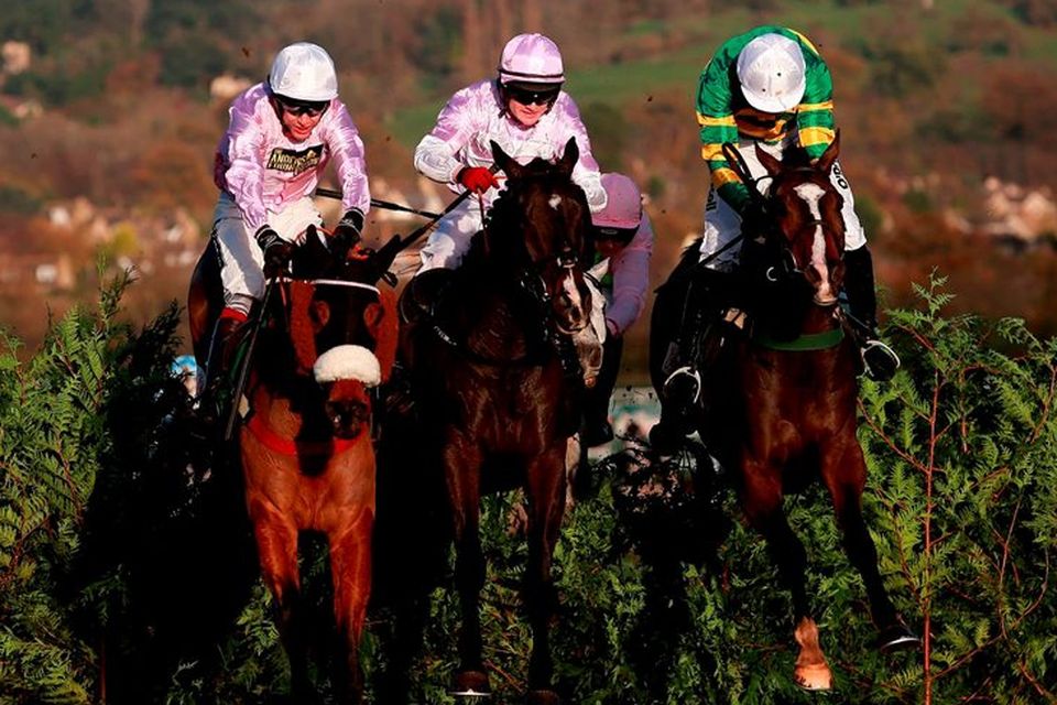 Eventual winner Josies Orders ridden by Nina Carberry (right) jumps the last with Bless The Wings ridden by Kevin Sexton (centre) and Any Currency ridden by Aidan Coleman in the Glenfarclas Cross Country Handicap Chase during day one of The Open at Cheltenham. David Davies/PA Wire.