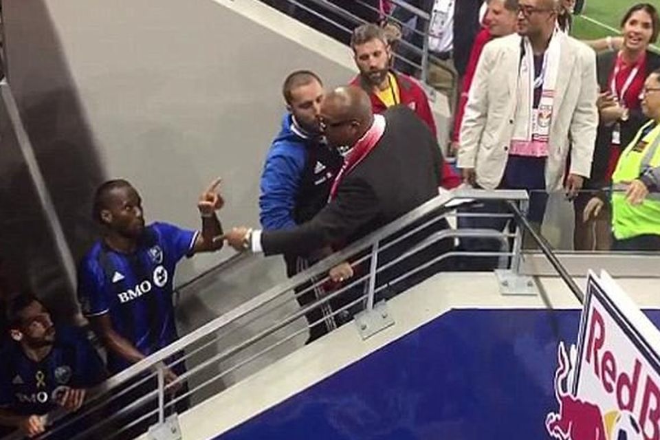 Flashpoint: Didier Drogba clashes with New York Red Bulls fans Vince (left) and Vance Moss CREDIT: ‏@KLIMBERGCALCIO