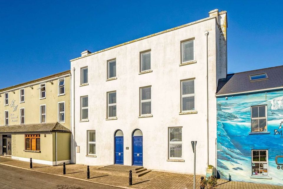 Marine House (blue doors) is on the market with a guide price of €950,000.