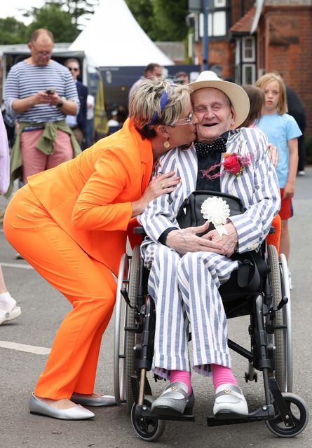 Best Dressed contestant Philip Brophy receives a birthday kiss from his carer Áine Cryan as he celebrates his 90th birthday. Photo: Leon Farrell / Photocall Ireland