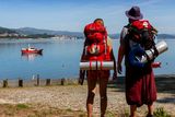 thumbnail: Two pilgrims look at the Miño river in Caminha, Portugal. Photo by Xurxo Lobato/Getty Images