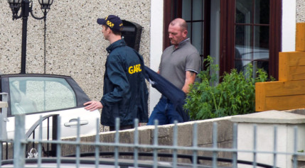 Gardai arresting Donal O’Hara during the raid on his home