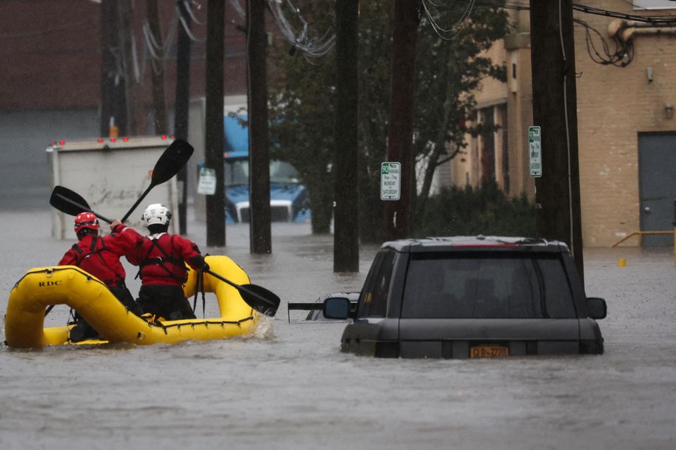 Special Operations Unit rescue personnel with the Westchester County Emergency Services paddle in rafts as they check buildings for victims trapped in heavy flooding in the New York City suburb of Mamaroneck, New York, U.S., September 29, 2023. REUTERS/Mike Segar