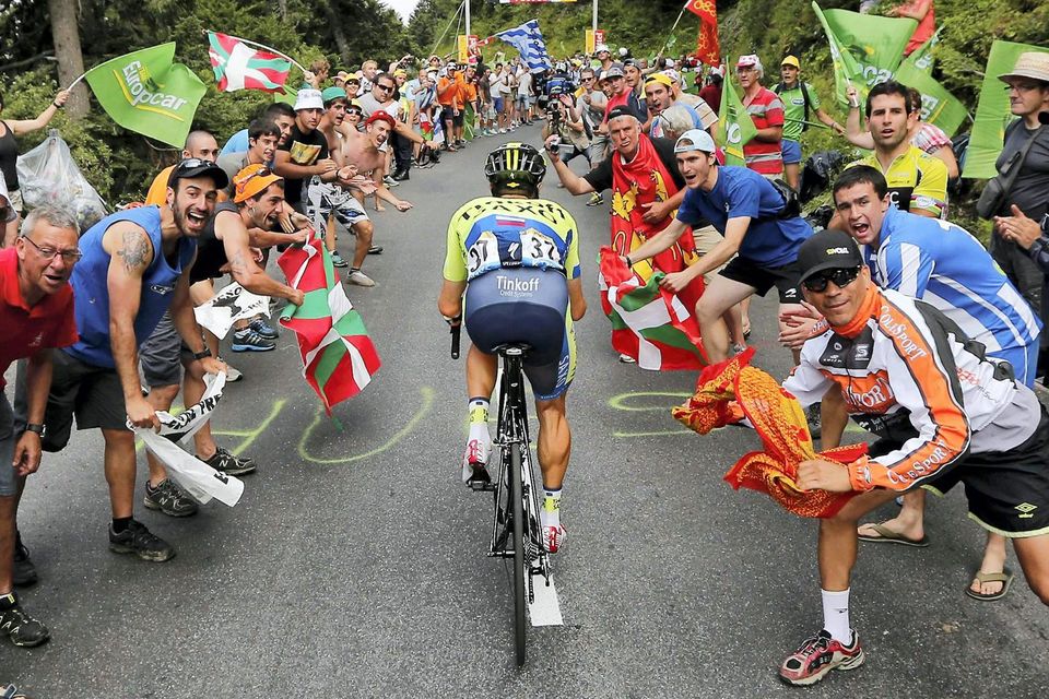 Nicolas Roche makes his way through the crowd during the 17th stage of the Tour de France in which he finished ninth. Photo: REUTERS/Jean-Paul Pelissier