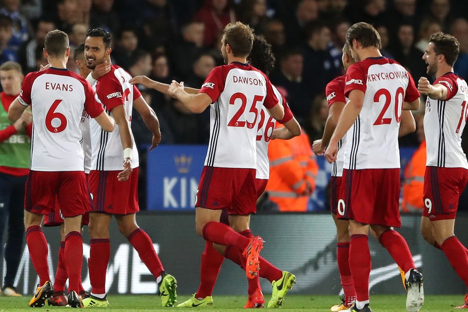 West Brom's Nacer Chadli, second left, celebrates scoring his side's goal in the draw at Leicester