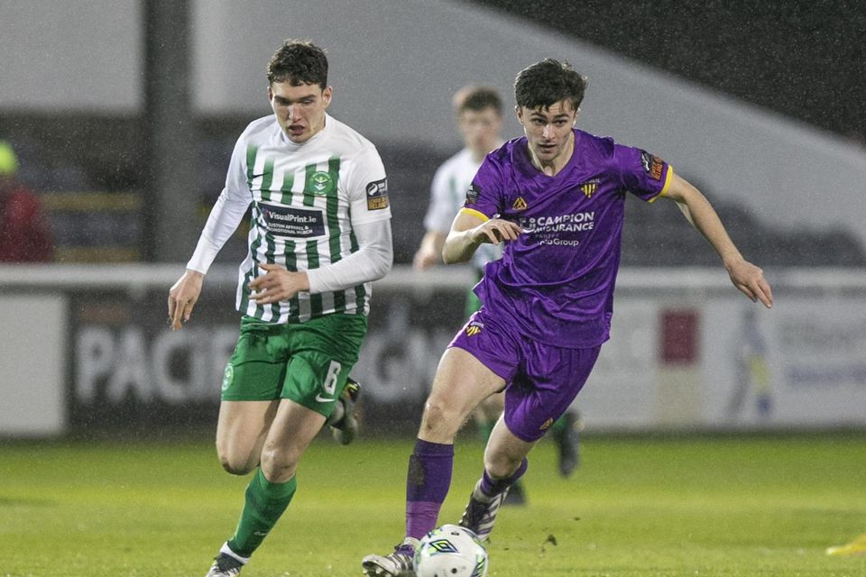 Wexford's Darragh Levingston steals the ball from Luka Lovic.