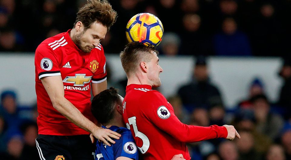 Manchester United's Daley Blind and Luke Shaw in action with Everton's Michael Keane. Photo: Reuters/Andrew Yates