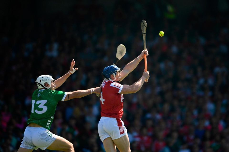 Sean O'Donoghue of Cork in action against Aaron Gillane of Limerick. Photo by Daire Brennan/Sportsfile