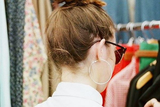 thumbnail: Siomha effortlessly carrying off the top knot hairstyle at a flea market in Brooklyn, New York. Photo: Siomha Connolly Instagram