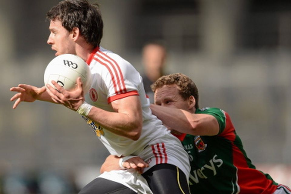 Tyrone's Matthew Donnelly in action against Andy Moran