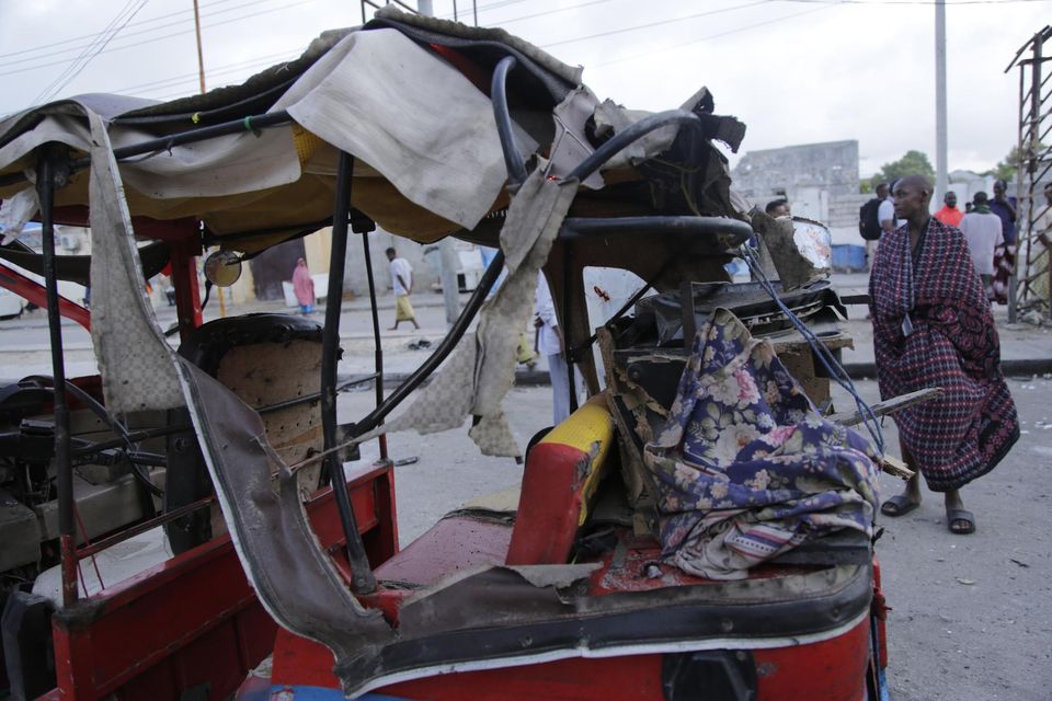 A destroyed tuktuk outside the Pearl Beach hotel in Mogadishu (AP)