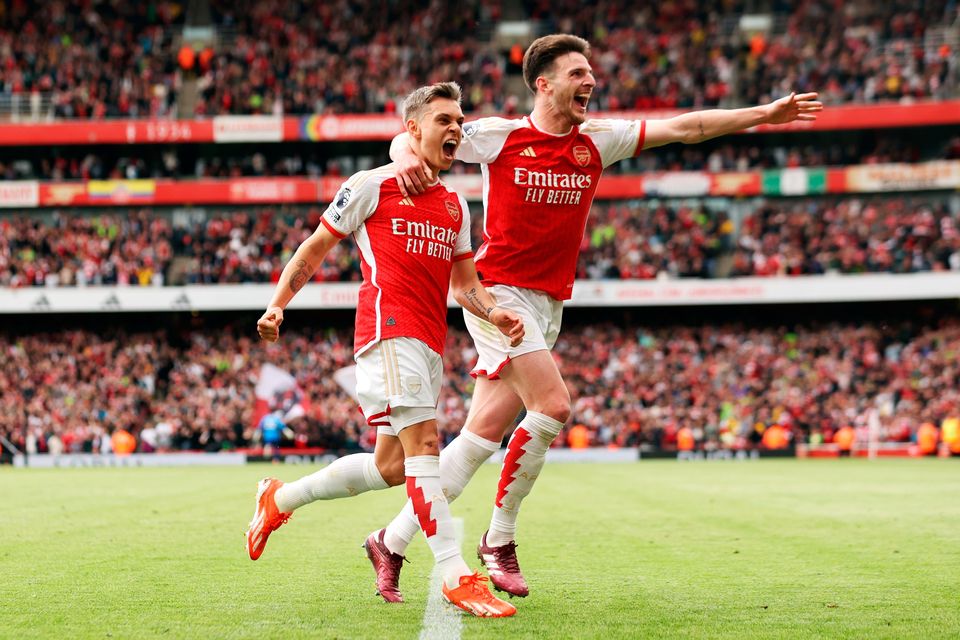 Leandro Trossard, left, of Arsenal celebrates scoring his team's second goal against Bournemouth with Declan Rice. Photo by Ryan Pierse/Getty Images