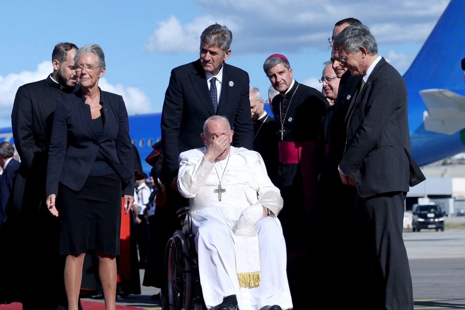 Pope Francis is welcomed by French prime minister Elisabeth Borne as he arrives in Marseille. Photo: Reuters